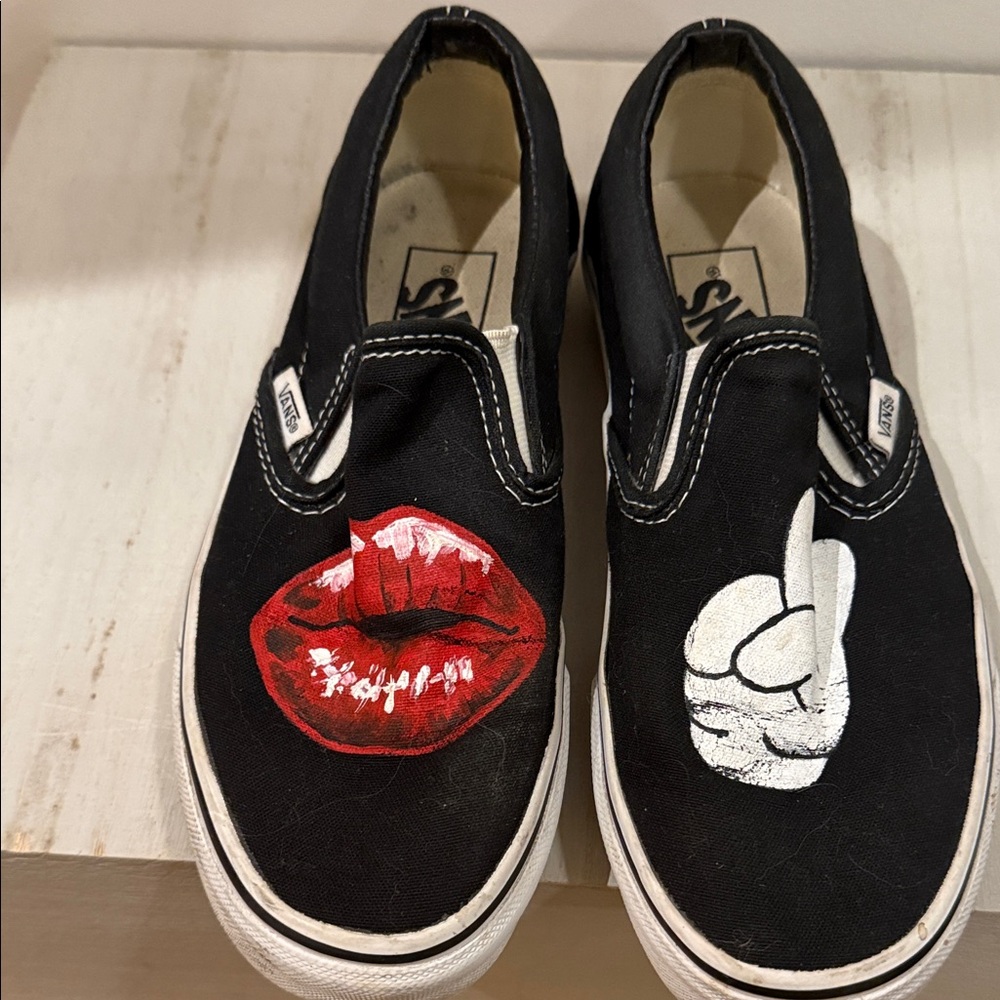 Vans Black Slip-Ons with Red and White Graphics